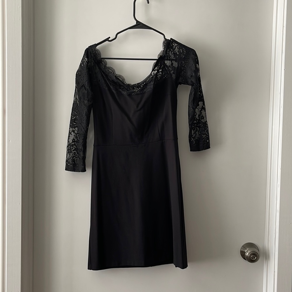 Black dress with lace detail on top, arms and back